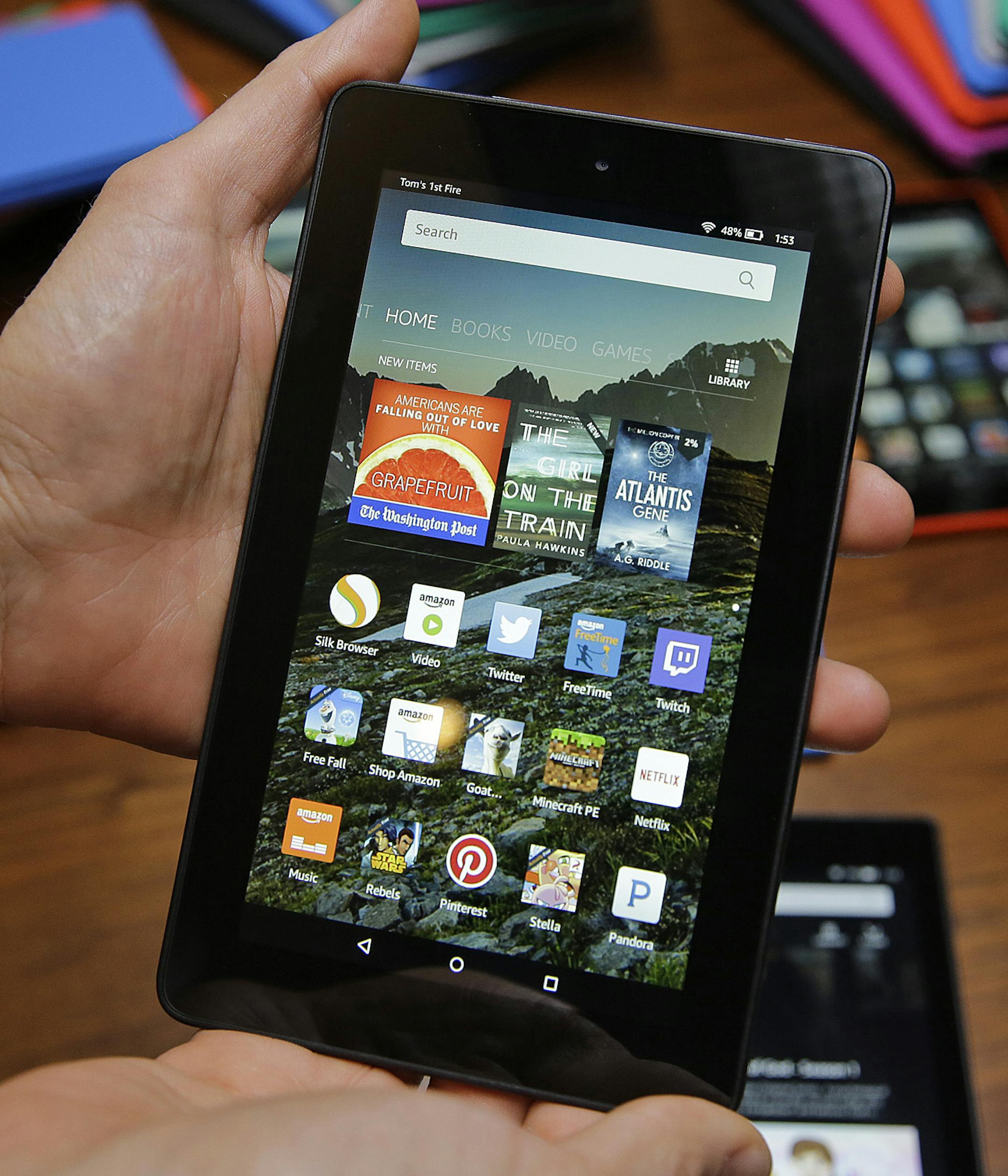 In this Wednesday, Sept. 16, 2015, photo, Amazon's new $50 Fire tablet is displayed in San Francisco. Amazon.com is introducing the $50 tablet computer in its latest attempt to boost its online store sales by luring consumers who canít afford more expensive Internet-connected devices made by Apple and other rivals. (AP Photo/Eric Risberg)