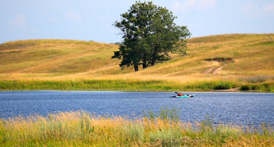 A kayaker paddled on Maple Marsh Lake Wednesday, July 19, 2023 at the Kelly Land and Cattle Co. in Marine on St. Croix, Minn. The 2,600-acre Kelly Farm will be sold to the DNR and Washington County in two phases this summer and fall. The land will become the Keystone Woods Wildlife Management Area. It's the largest ever land purchase for the state's Outdoor Heritage Fund, and the area will become the largest piece of public land in Washington County. ] ANTHONY SOUFFLE • anthony.souffle@startribune.com