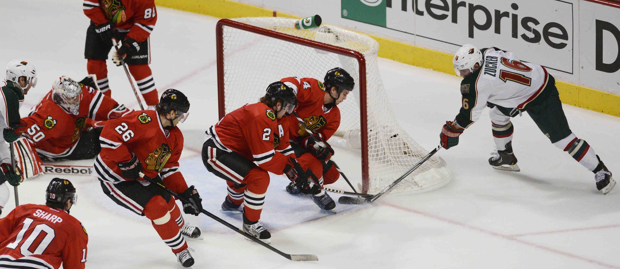 Chicago Blackhawks Niklas Hjalmarsson and Duncan Keith defend the goal against Minnesota Wild left wing Jason Zucker in Game 1 of an NHL hockey Stanley Cup playoff series Tuesday, April 30, 2013, in Chicago. The Blackhawks defeated the Wild 2-1. (AP Photo/Daily Herald, John Starks )