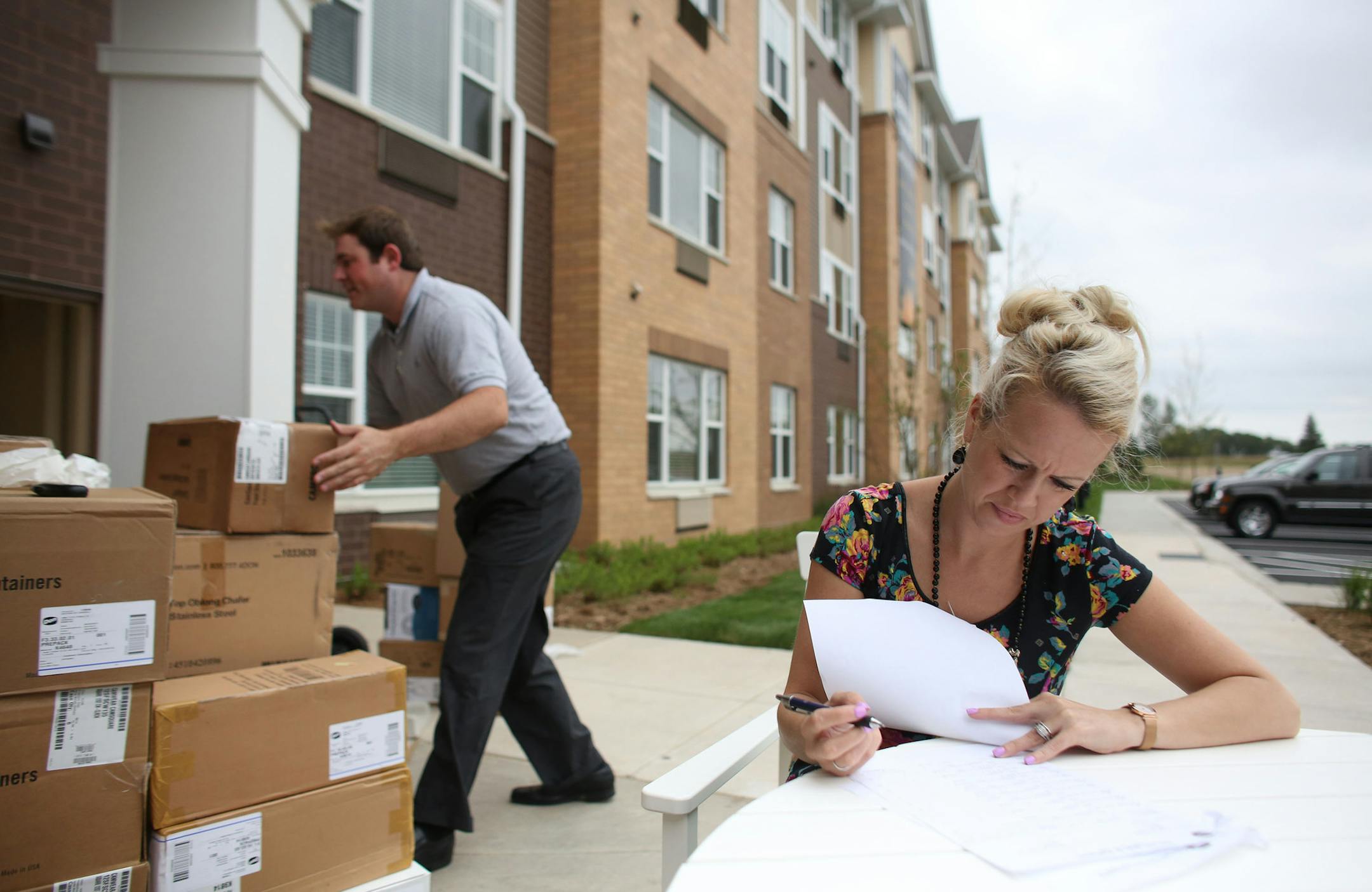 Rachel Hammer, systems general manager at The Waters, went through the inventory list with Dan Kovalesky, sales rep with Edward Don, as they prepare the restaurant for the grand opening. ] (KYNDELL HARKNESS/STAR TRIBUNE) kyndell.harkness@startribune.com A new affordable senior housing complex, The Waters in Oakdale, will open where a shopping mall once stood in Oakdale, Min., Tuesday, September 9, 2014.