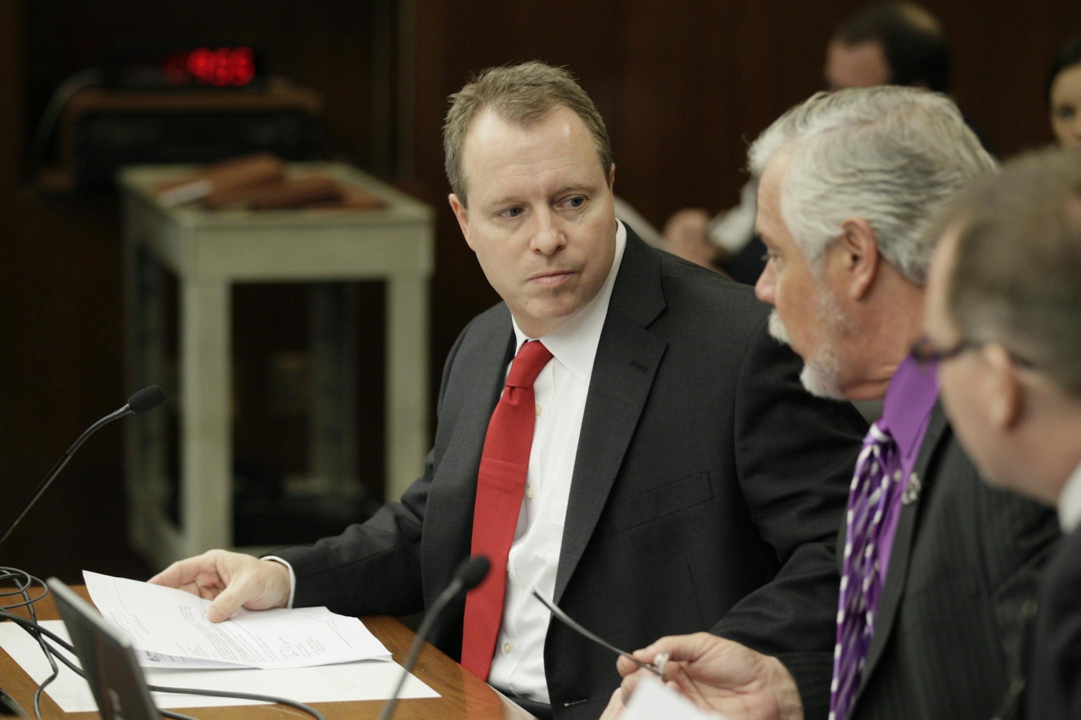 Cook County Attorney Tim Scannell, left, testifies in favor Thursday of House bill 1829, which would allow county attorneys to carry firearms on duty. Scannell was shot during a trial by defendant Daniel Schilenz.