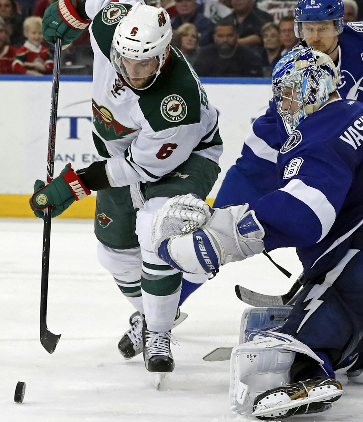 Minnesota Wild's Marco Scandella looks for a rebound in front of Tampa Bay Lightning goalie Andrei Vasilevskiy, of Russia, during the third period of an NHL hockey game Thursday, March 9, 2017, in Tampa, Fla. The Lightning won 4-1. (AP Photo/Mike Carlson)