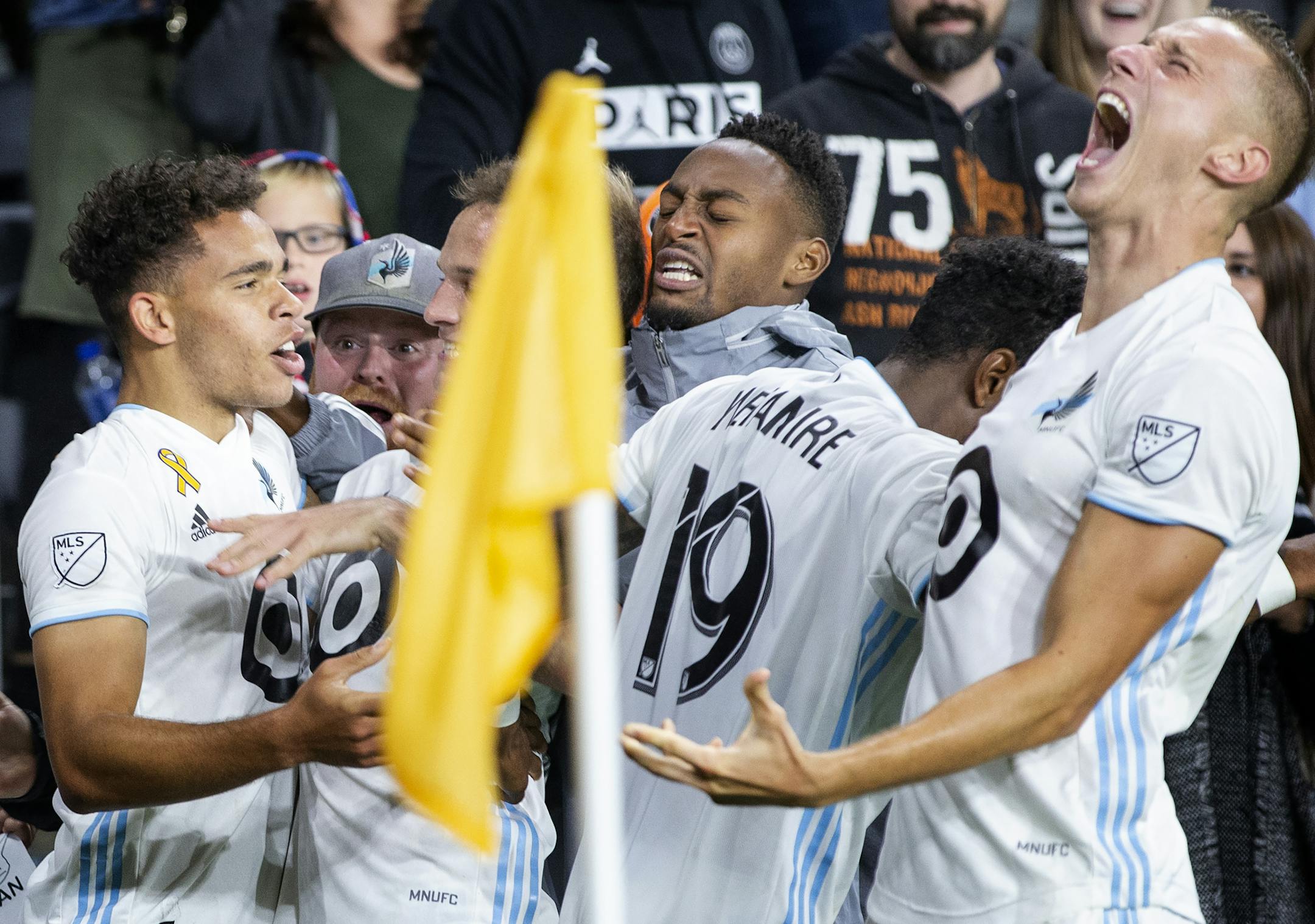 Hassani Dotson (31) of Minnesota United celebrated with teammates after scoring the winning goal.