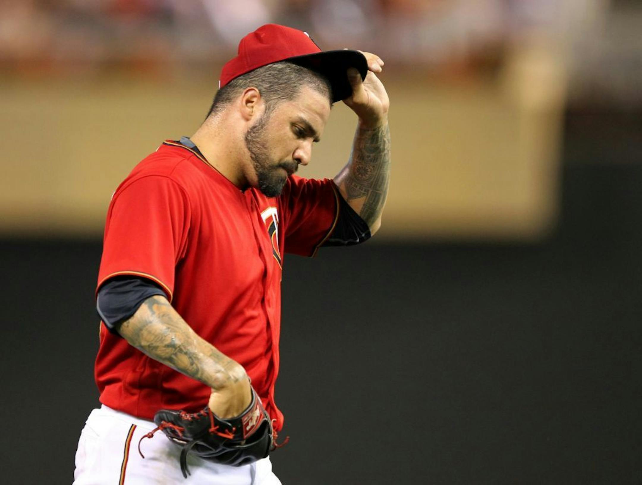 Minnesota Twins pitcher Hector Santiago leaves the game against the Houston Astros in the sixth inning during a baseball game on Tuesday, Aug., 9, 2016 in Minneapolis. The Astros defeated the Twins 7-5.