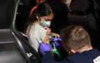 A San Ramon Valley Fire District worker administered a COVID-19 vaccine to an 11-year-old in San Ramon, Calif., on Dec. 16, 2021. 