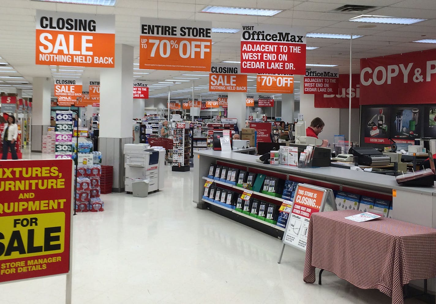 An Office Depot store in downtown Minneapolis displays "store closing" sale signs in August 2014.