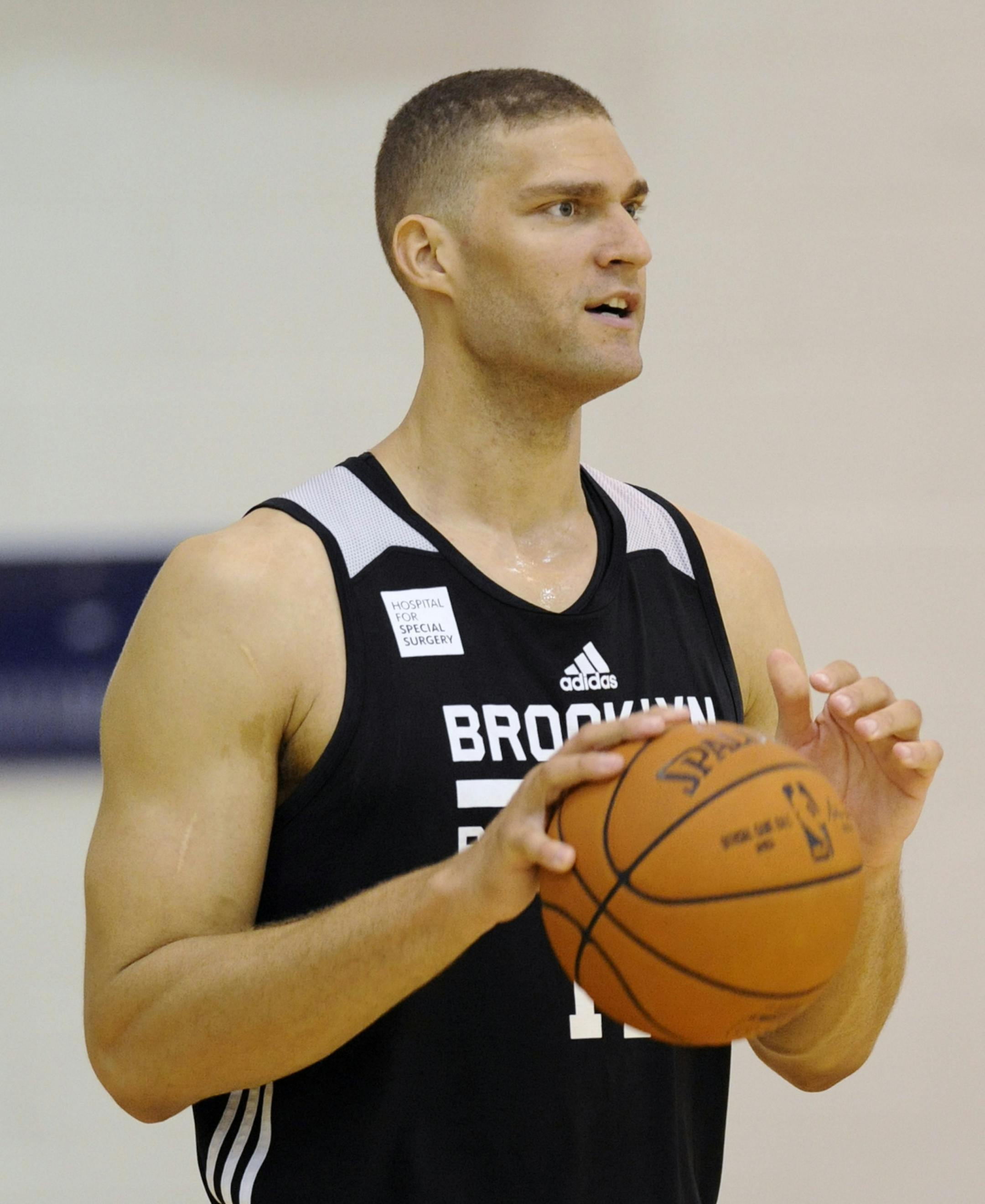 CORRECTS DAY TO SATURDAY Brooklyn Nets' Brook Lopez looks on after an NBA basketball practice, Saturday, Sept. 27, 2014, in East Rutherford, N.J. (AP Photo/Bill Kostroun) ORG XMIT: NJBK101