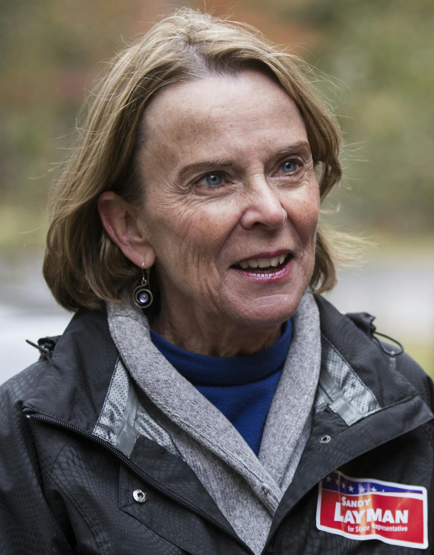 Sandy Layman, left, talks with Kyle Kleinendorst while door-knocking for her campaign in Grand Rapids. ] (Leila Navidi/Star Tribune) leila.navidi@startribune.com BACKGROUND INFORMATION: Sandy Layman, former IRRRB commissioner, campaigns for the Minnesota House of Representatives District 05B seat in Grand Rapids on Friday, October 7, 2016. The seat is currently held by Rep. Tom Anzelc, DFL-Balsam Township.