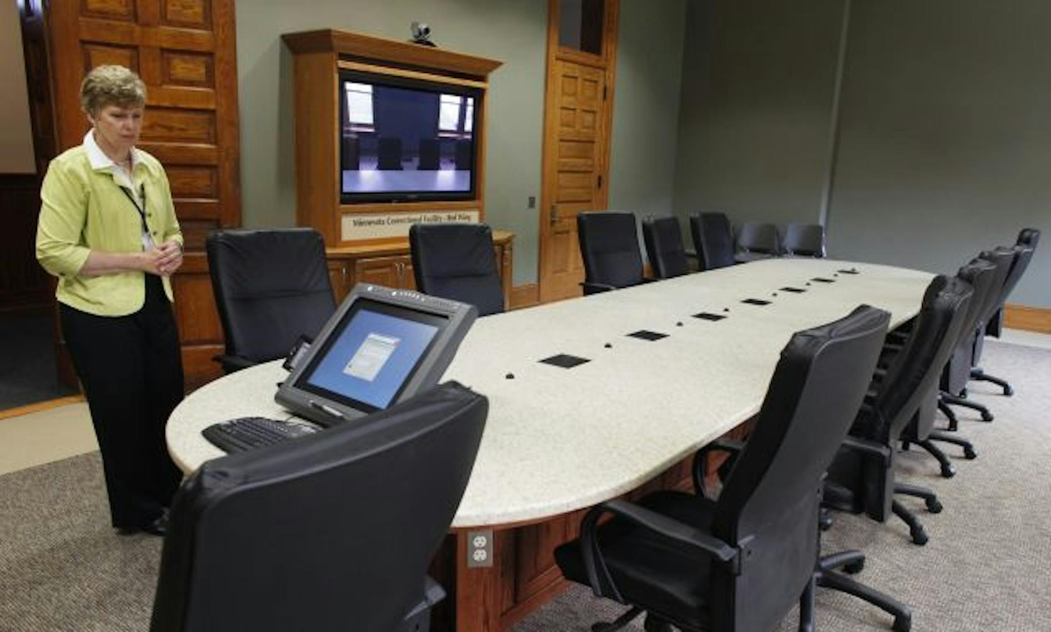 Administrative assistant Kathy Johnson demonstrated the new $4,300 plasma TV and $11,000 teleconferencing system at the juvenile prison in Red Wing, Minn., on Thursday.