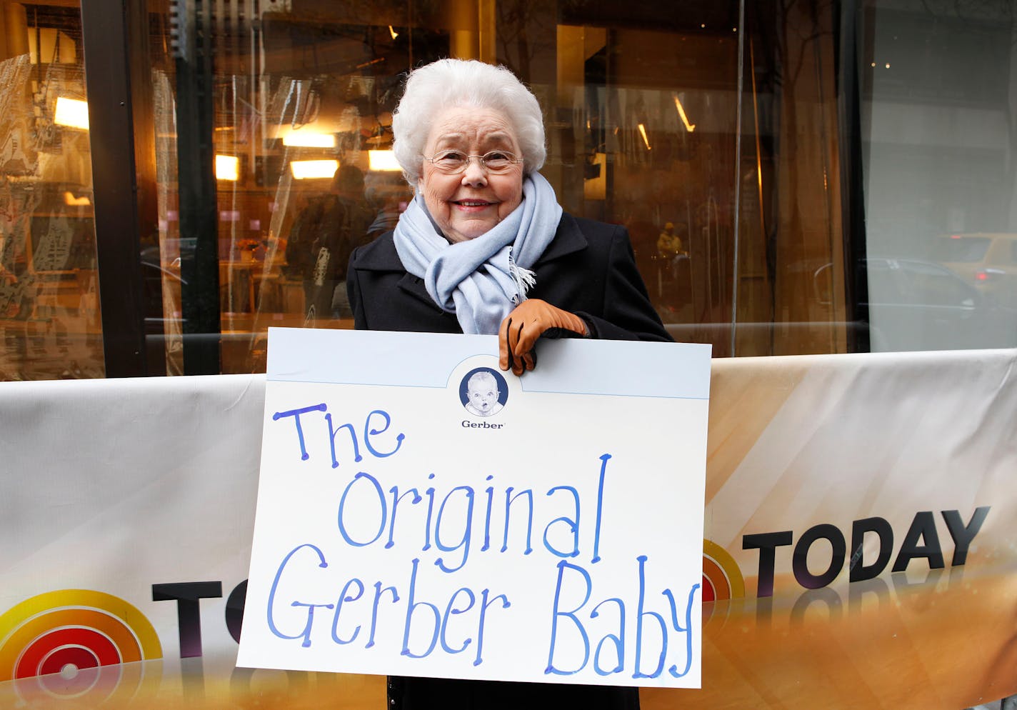 FILE - In this photo provided by Gerber, Ann Turner Cook, whose baby face launched the iconic Gerber logo, arrives at NBC's Today Show to announce the winner of the 2012 Gerber Generation Photo Search on Tuesday, Nov. 6, 2012 in New York City. Ann Turner Cook, whose cherubic baby face was known the world over as the original Gerber baby, has died. She was 95. Gerber announced Cook's passing in an Instagram post on Friday, June 3, 2022. ( (Amy Sussman/Gerber via AP, File)