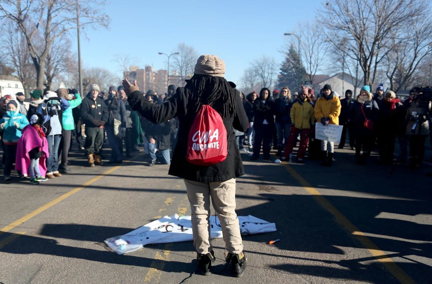 Alanna Galloway, of CWA Local 7250 spoke to a crowd of union workers and protesters in front of the Minneapolis Fourth Precinct.