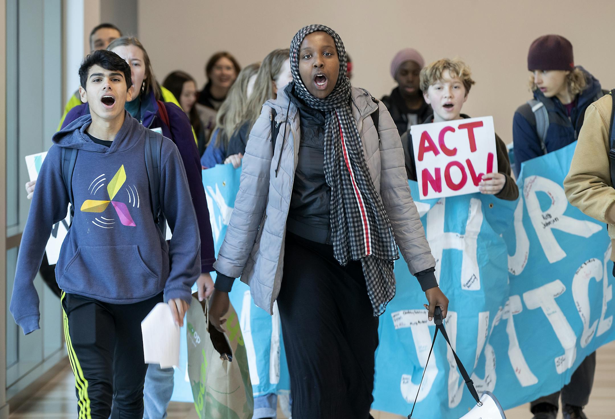 Young Minnesota activists made their way through the skyway on their way to the Xcel offices to demand that they stop buying energy from the HERC incinerator and promote a just transition to clean energy through a number of other policies, Friday, December 6, 2019 in downtown Minneapolis, MN. ELIZABETH FLORES • liz.flores@startribune.com