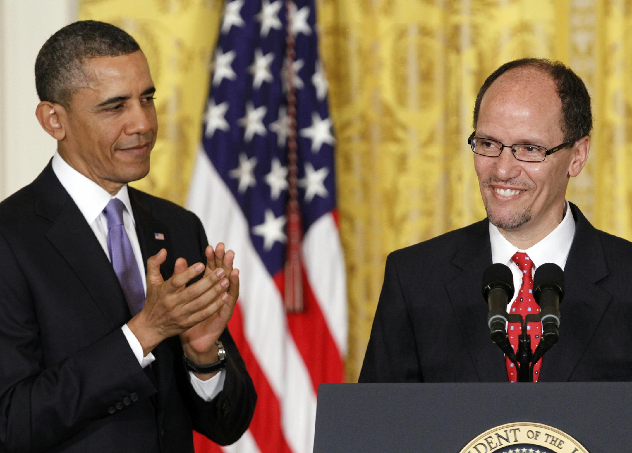 President Barack Obama applauds in the East Room of the White House in Washington, Monday March 18, 2013, where he announced he would nominate Thomas E. Perez, right, for Labor Secretary. (AP Photo/Jacquelyn Martin)