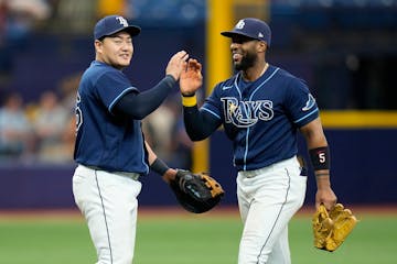 Tampa Bay first baseman Ji-Man Choi, left, and third baseman Yandy Diaz celebrated their three-game series sweep of St. Louis on Thursday.