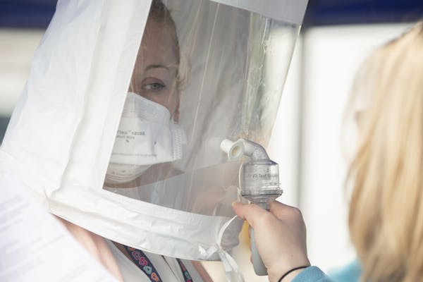 Kristen Davis, LPN, left, undergoes fit-testing for an N95 mask at a training session presented by the Virginia Department of Health's Medical Reserve