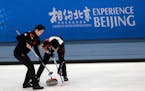 Local team players competed in a curling competition during a test event for the 2022 Winter Olympics at National Aquatic Center, also known as the �