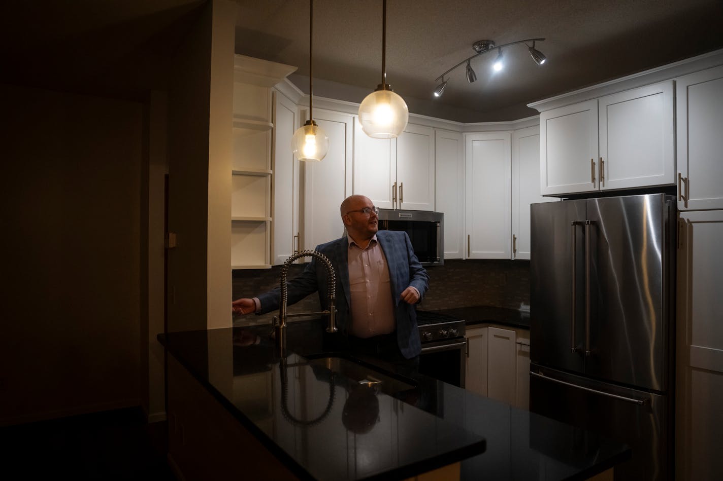 Realtor Josh Nelson turned on the lights in a townhome in Woodbury he showed to clients Wednesday.