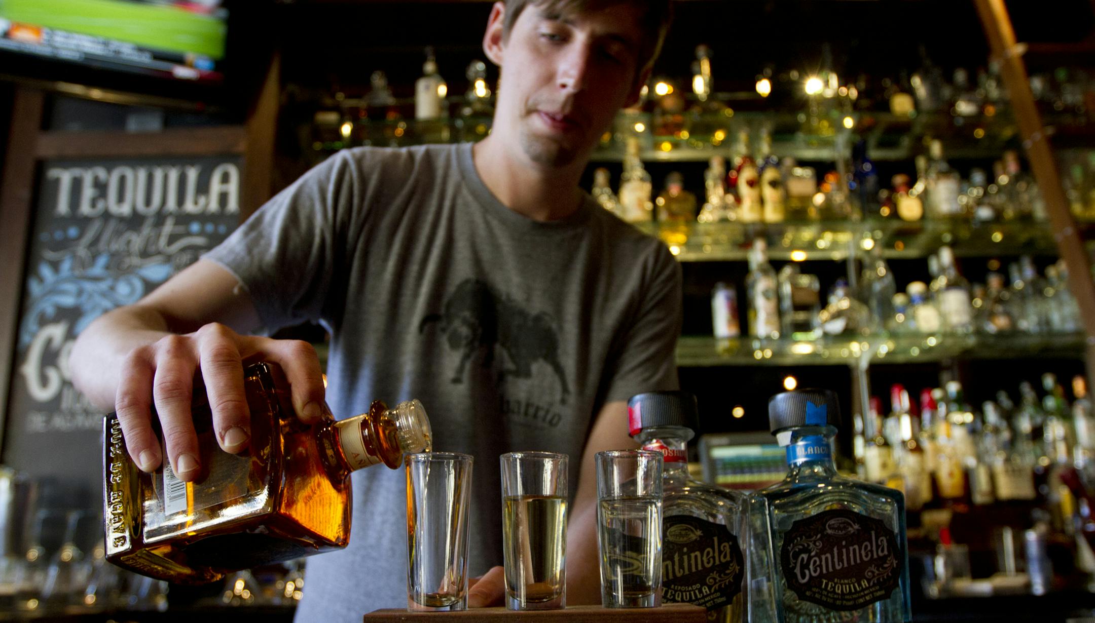 Bartender Samuel Gleeson poured a Centinela, Barrio's tequila flight of the month, on Friday, April 26 in downtown St. Paul. Barrio has an extensive menu of tequilas. ] NICOLA LOSIK* nicola.losik@startribune.com