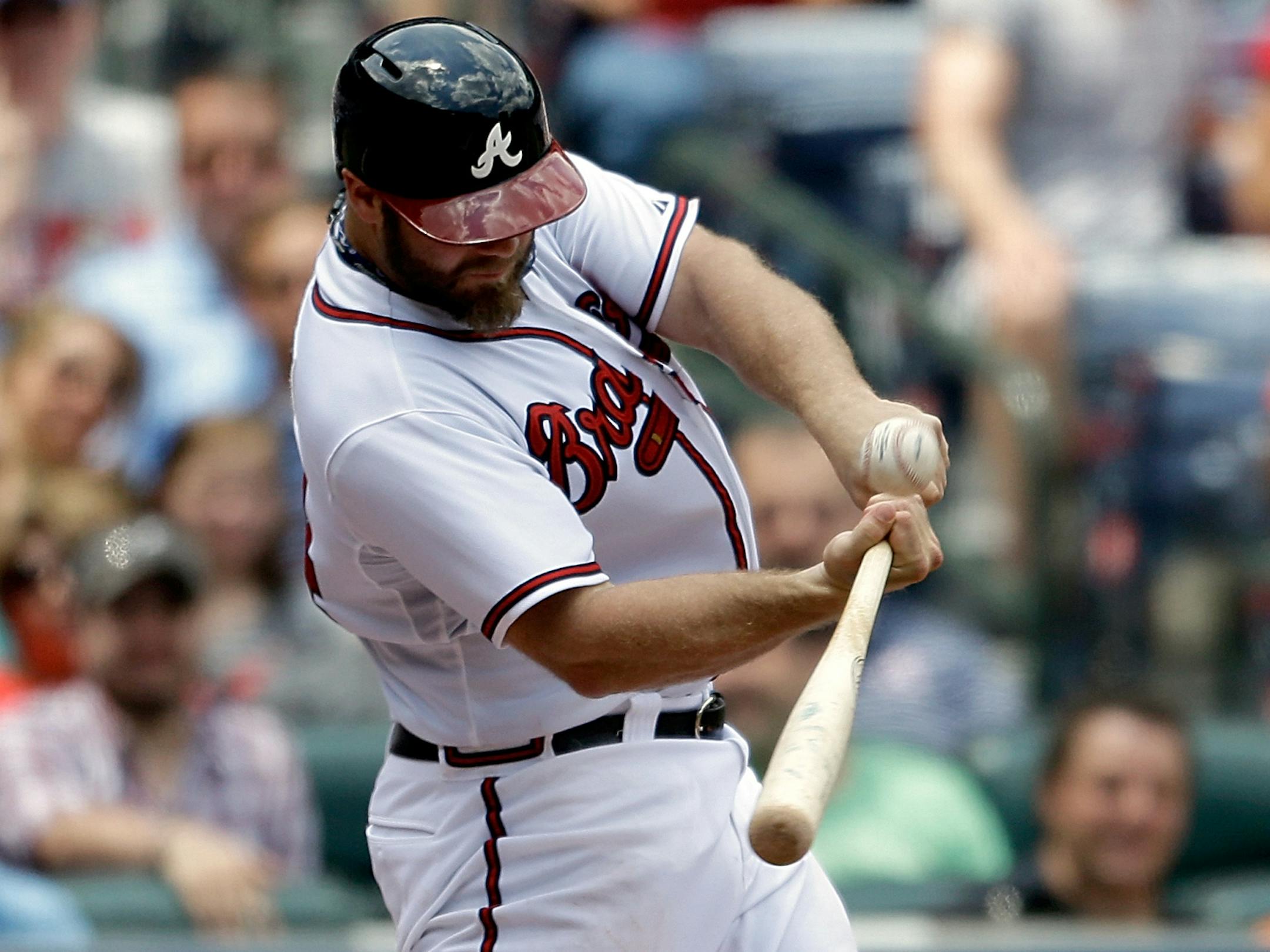 Atlanta Braves' Evan Gattis hits a grand slam in the fourth inning of a baseball game against the Minnesota Twins, Wednesday, May 22, 2013, in Atlanta. (AP Photo/David Goldman)