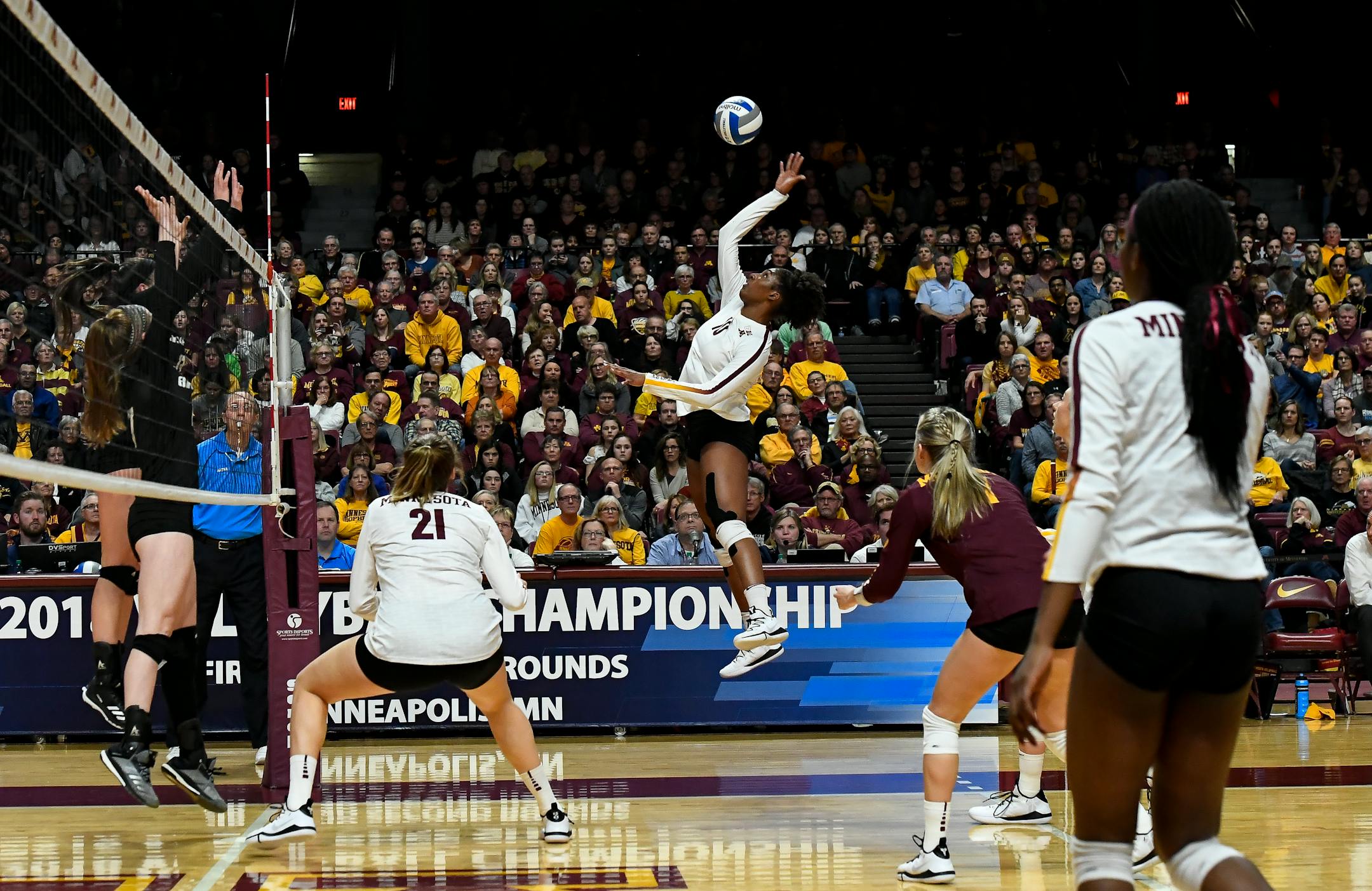 Gophers right side hitter Stephanie Samedy (10) spiked the ball against Bryant during last weekend's opening round.