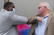 (Left) Duluth Human Rights Officer Carl Crawford greeted Governor Tim Walz with an elbow bump on Monday morning.