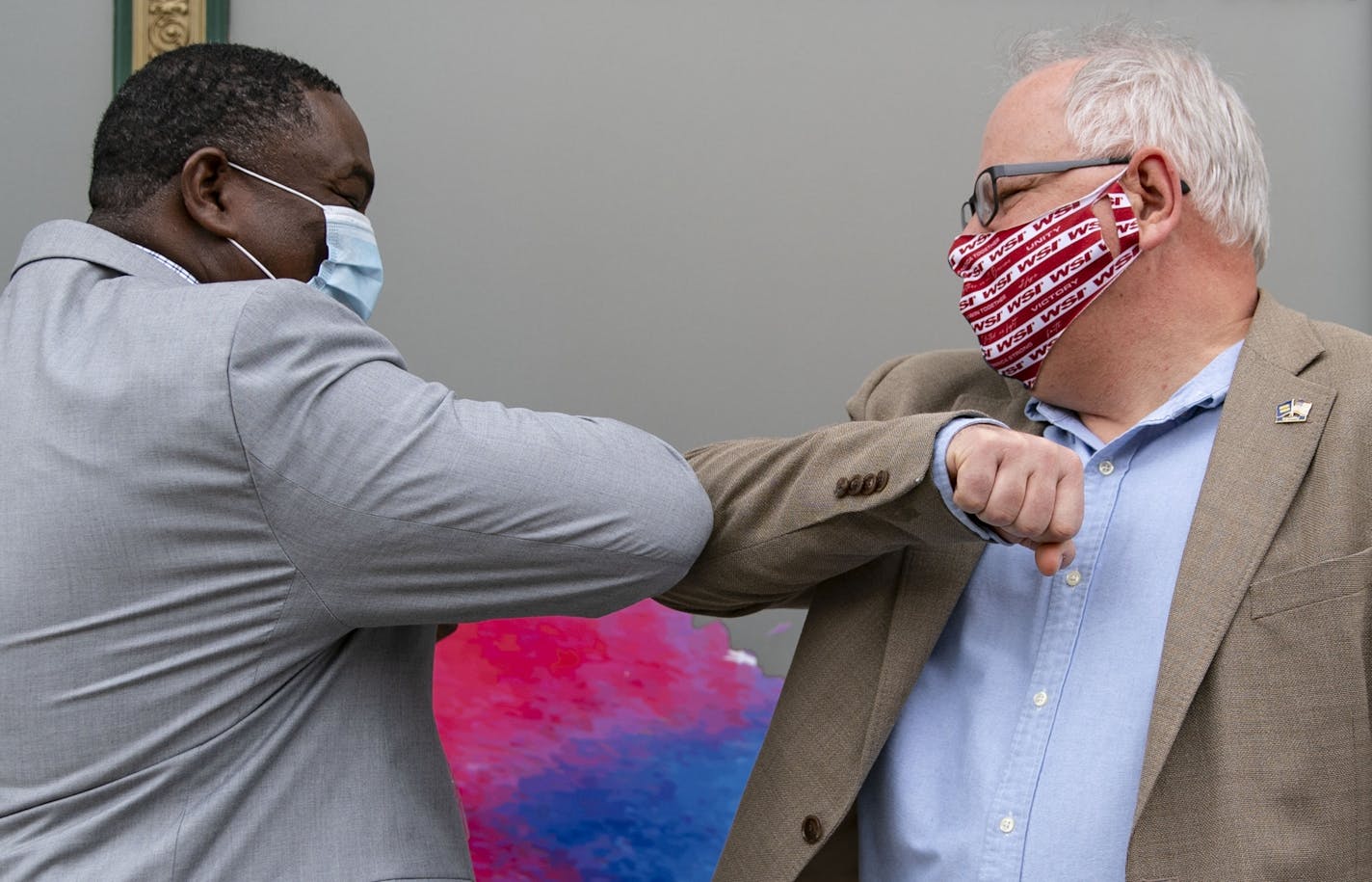 (Left) Duluth Human Rights Officer Carl Crawford greeted Governor Tim Walz with an elbow bump on Monday morning.