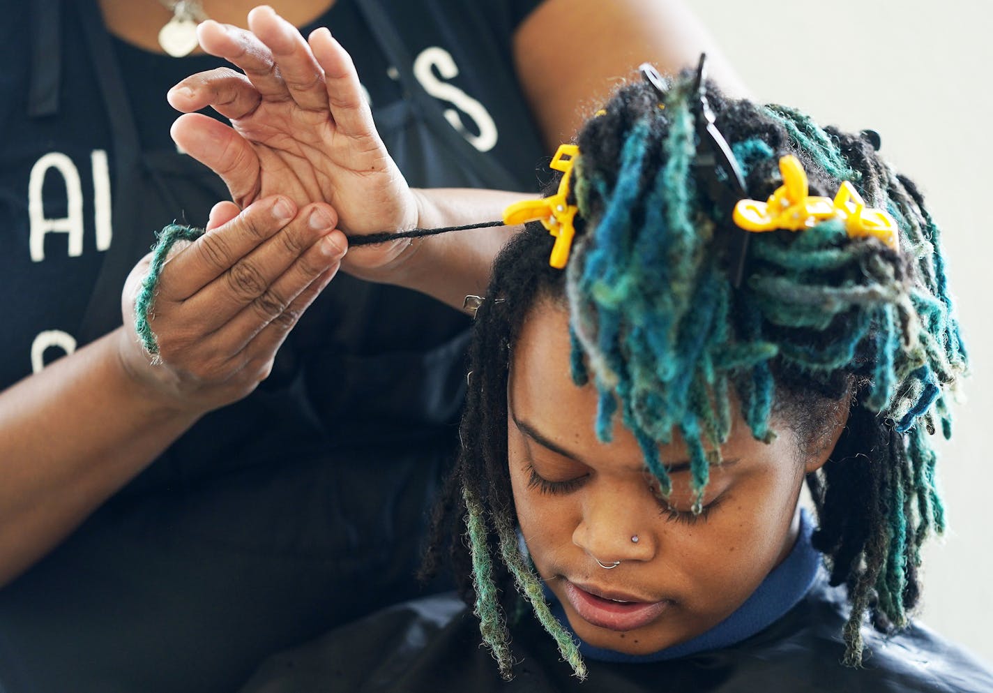 Stylist Erika Carter worked on AK Wright's hair Wednesday morning at the Beauty Lounge. ] ANTHONY SOUFFLE &#x2022; anthony.souffle@startribune.com Stylists worked on clients hair Wednesday, Feb. 12, 2020 at the Beauty Lounge in south Minneapolis.