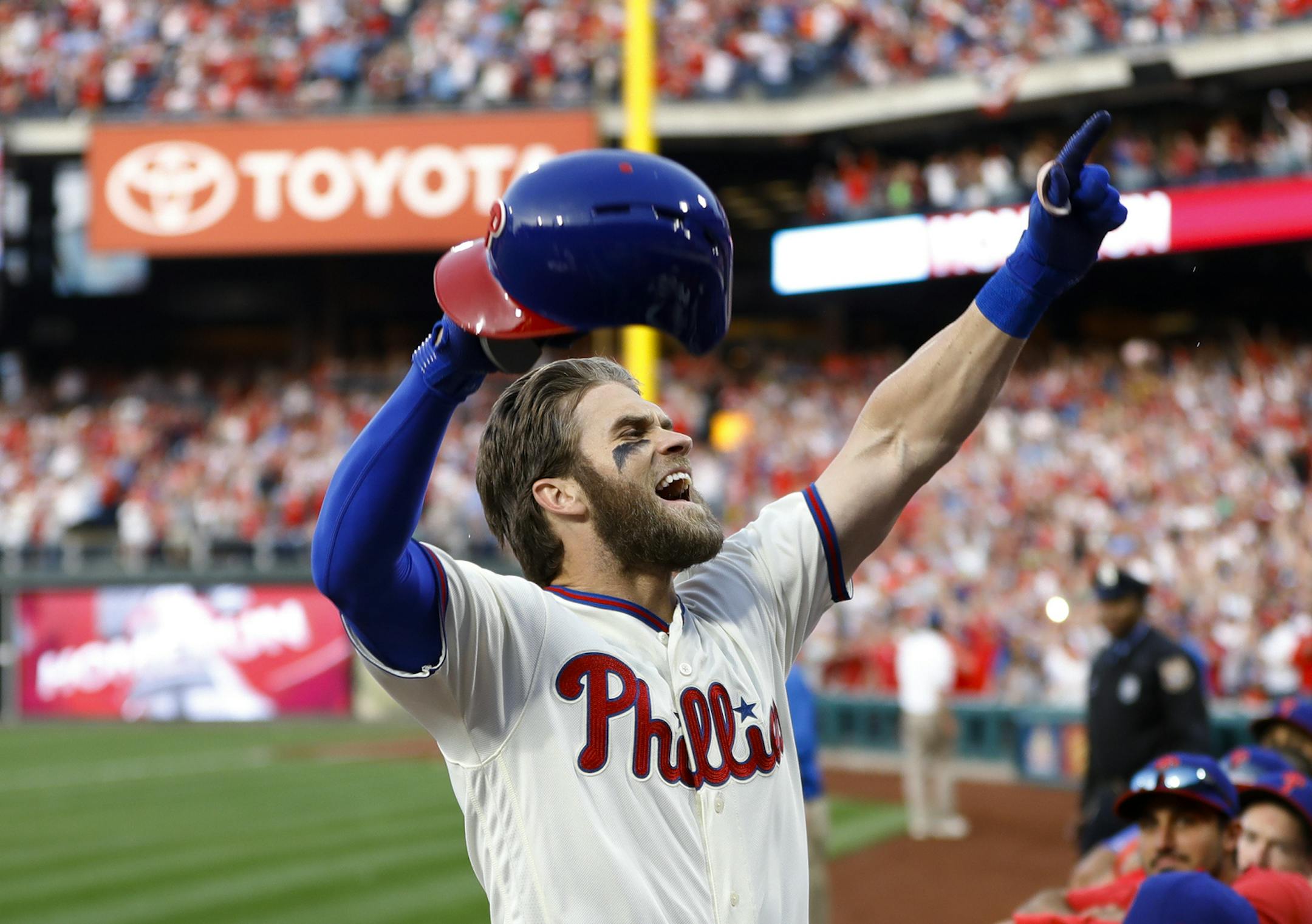 Philadelphia Phillies' Bryce Harper celebrates after hitting a home run off Atlanta Braves relief pitcher Jesse Biddle during the seventh inning of a baseball game, Saturday, March 30, 2019, in Philadelphia. (AP Photo/Matt Slocum) ORG XMIT: PXS113