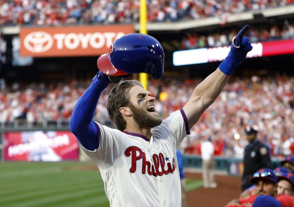 Philadelphia Phillies' Bryce Harper celebrates after hitting a home run off Atlanta Braves relief pitcher Jesse Biddle during the seventh inning of a 