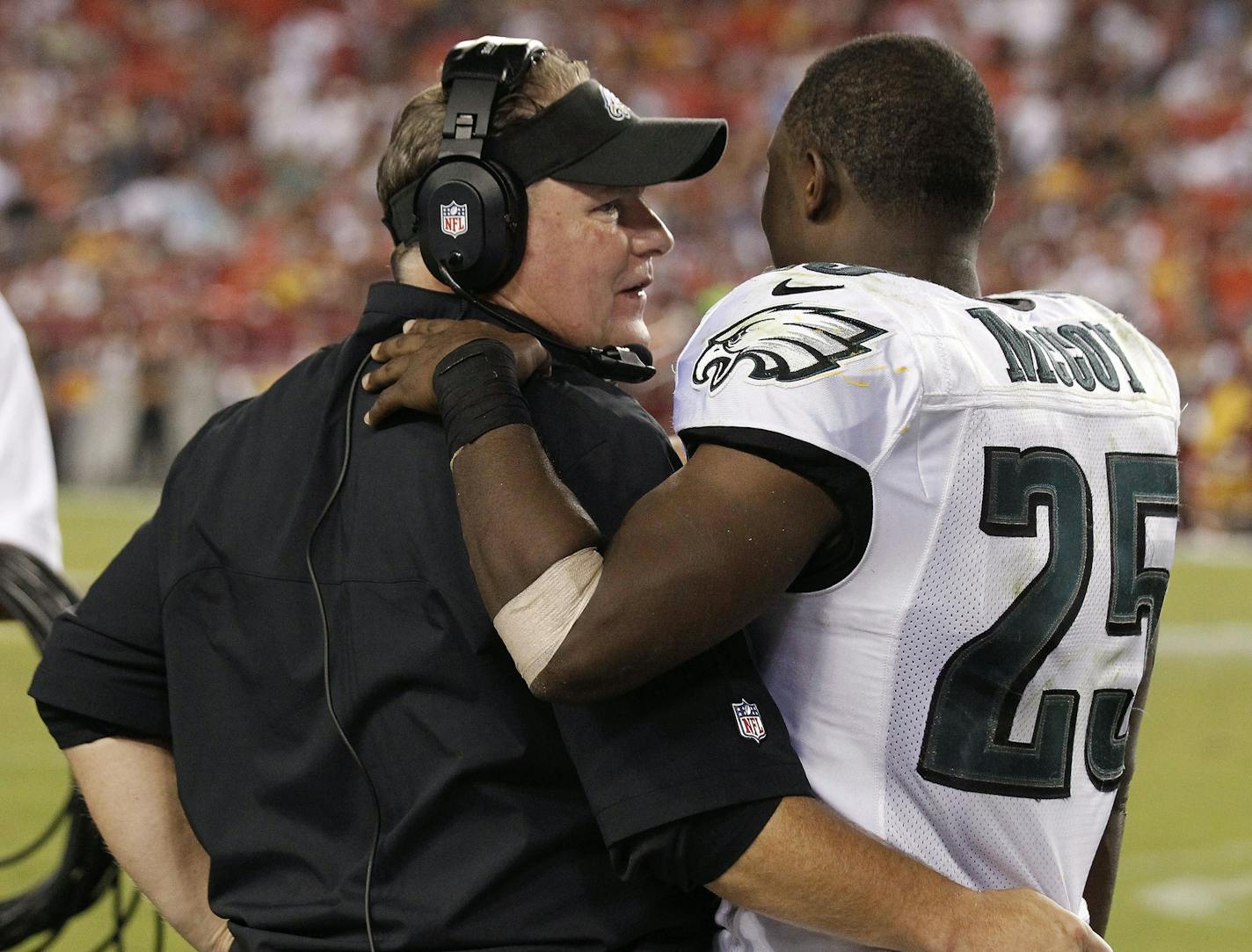 Philadelphia Eagles head coach Chip Kelly talks with running back LeSean McCoy (25)