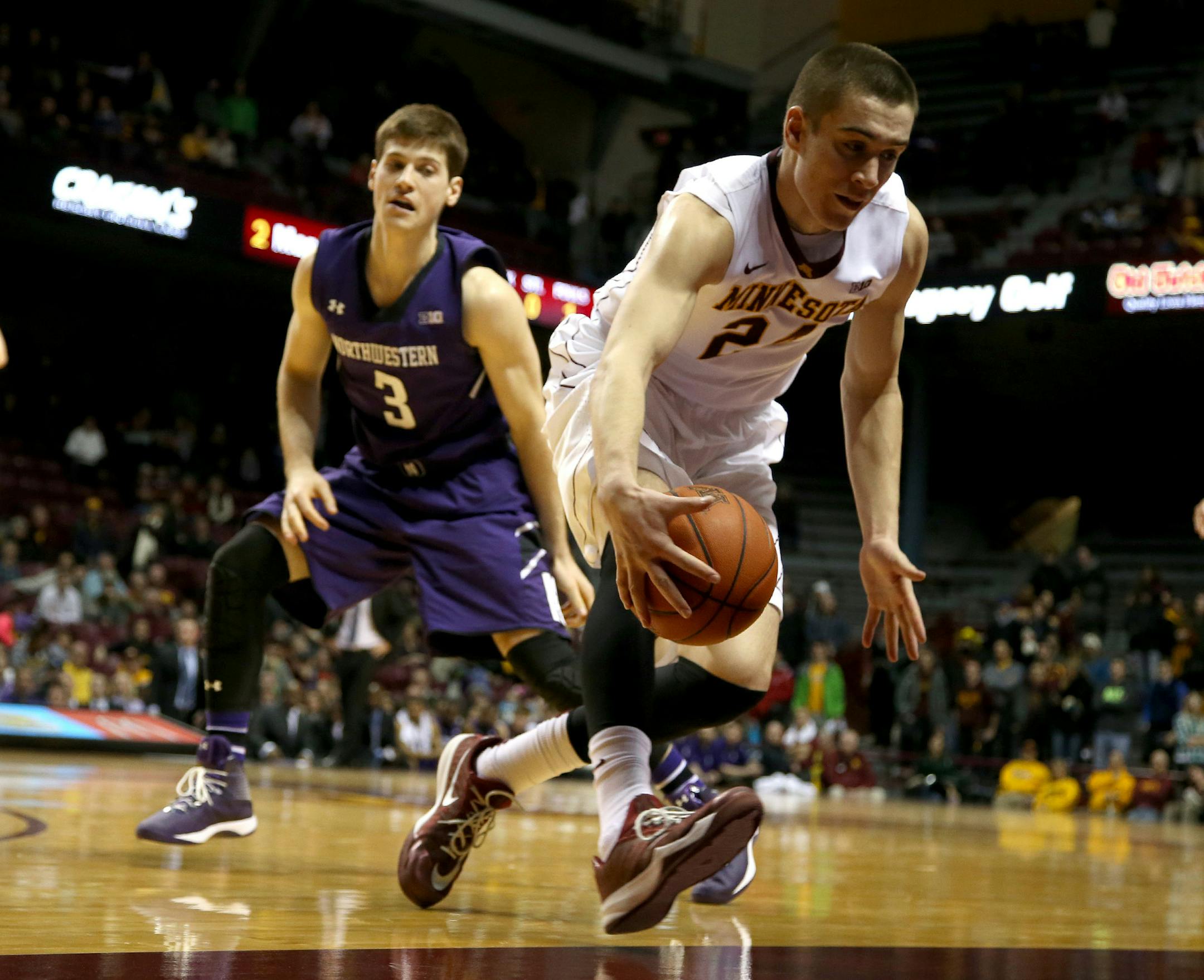 Gopher Joey Kingtried to save a ball from going out of bounds the second half. ] (KYNDELL HARKNESS/STAR TRIBUNE) kyndell.harkness@startribune.com Gophers vs Northwestern at Williams Arena in Minneapolis, Min., Wednesday, February 18, 2015. Northwestern won over the Gophers 72-66