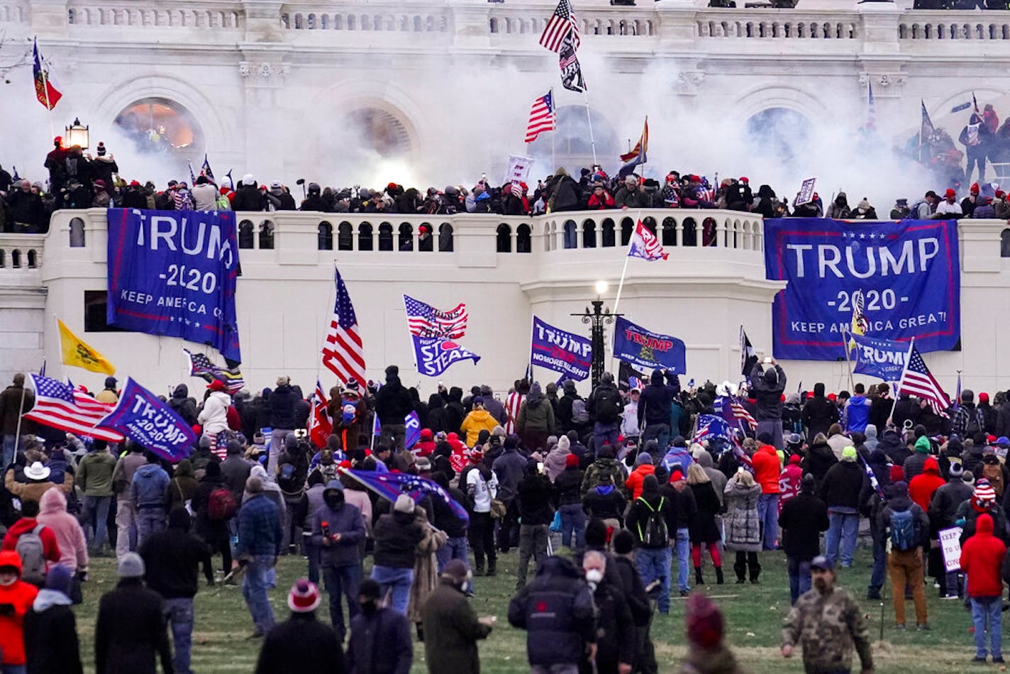 FILE - In this Wednesday, Jan. 6, 2021, file photo, violent rioters supporting President Donald Trump, storm the Capitol in Washington. A faction of local, county and state Republican officials across the country is pushing lies, misinformation and conspiracy theories online that echo those that helped inspire the violent Capitol insurrection, forcing the GOP into an internal reckoning.. (AP Photo/John Minchillo, File)