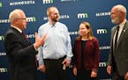 From left, Minnesota Governor Tim Walz speaks with meteorologist Matt Taraldsen and commissioner Katrina Kessler, with the Minnesota Pollution Control