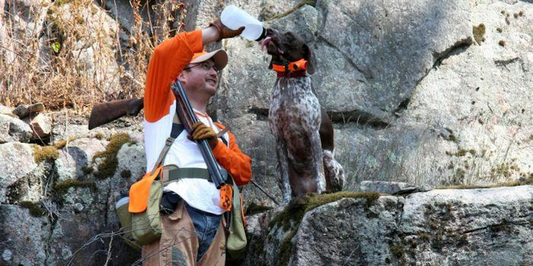The author and his pup, Trammell, take a much needed water break during 85 degree heat during this weekend's grouse opener.