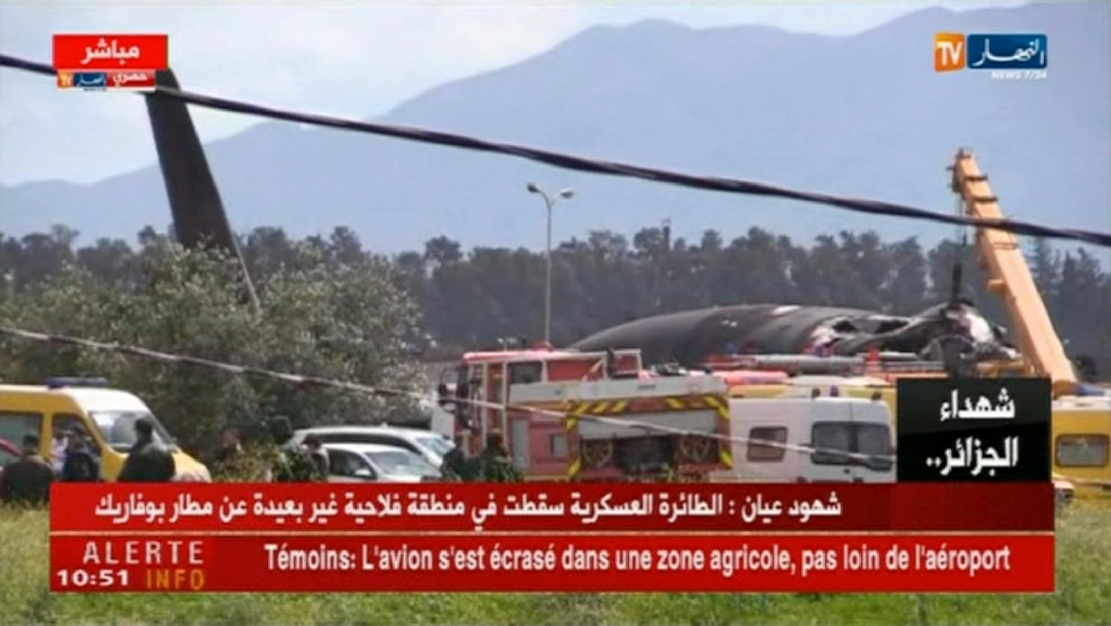 In this still taken from TV showing emergency services at the scene after a military plane crashed soon after takeoff at Boufarik military base, Algeria, Wednesday April 11, 2018.
