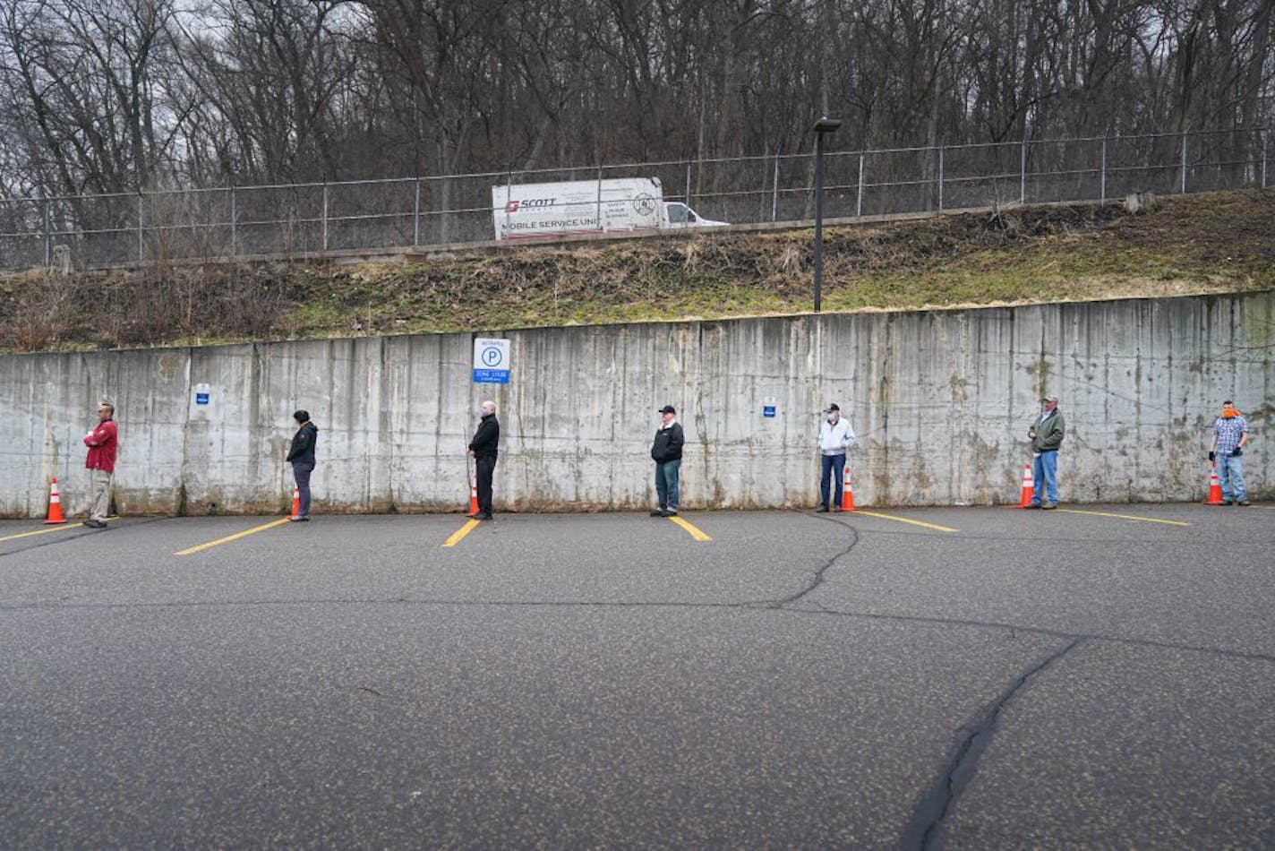 Voters in Hudson, Wisconsin were allowed into the firehouse one by one to vote in Tuesday's primary. They lined up next to cones in the parking lot that were ten feet apart. They started at a hand washing station and voting equipment was sanitized after each voter.