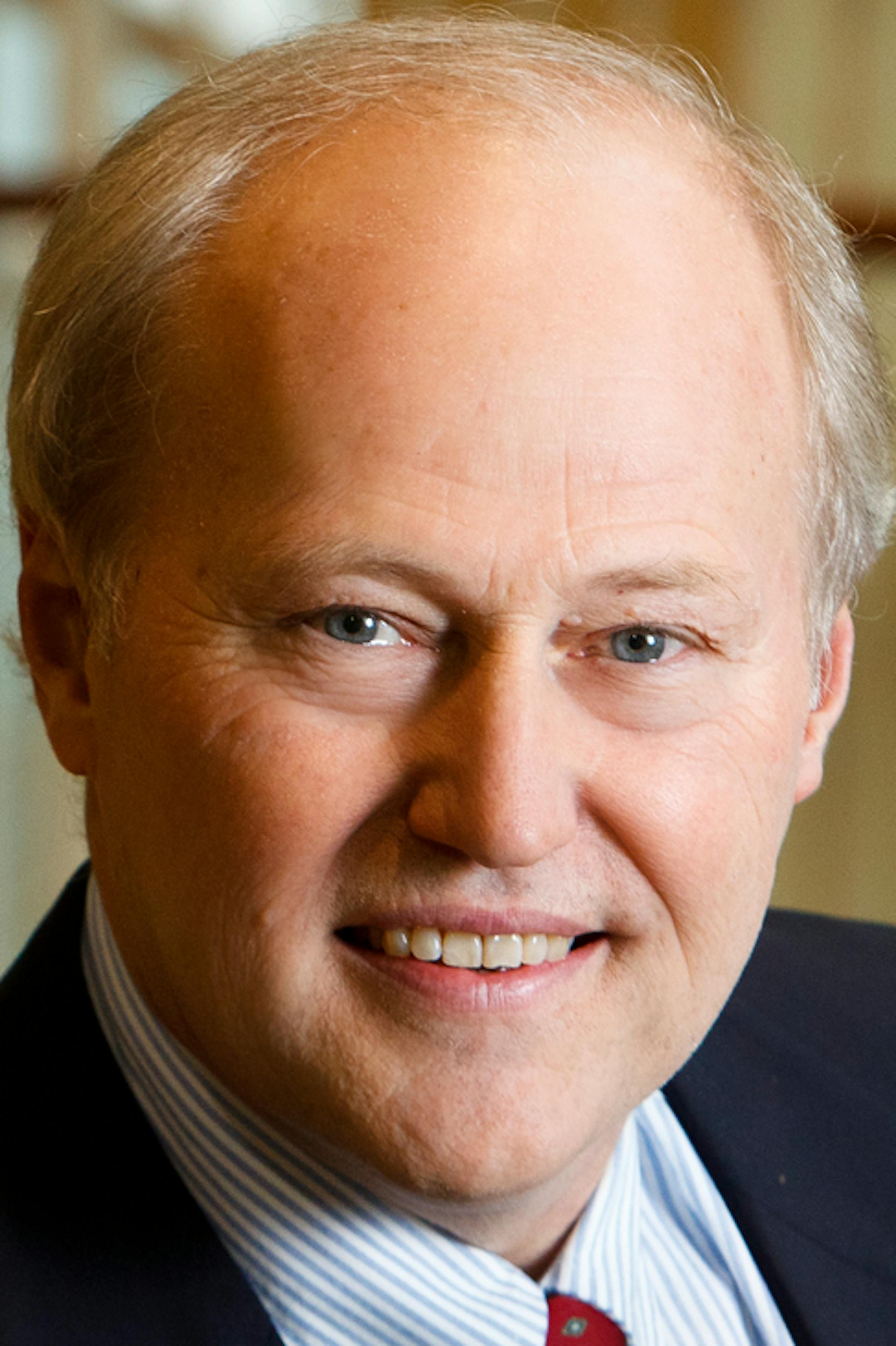 Environmental portrait of Opus College of Business marketing professor Rich Rexeisen. Taken December 3, 2010 on the stairs in the atrium of Schulze Hall.