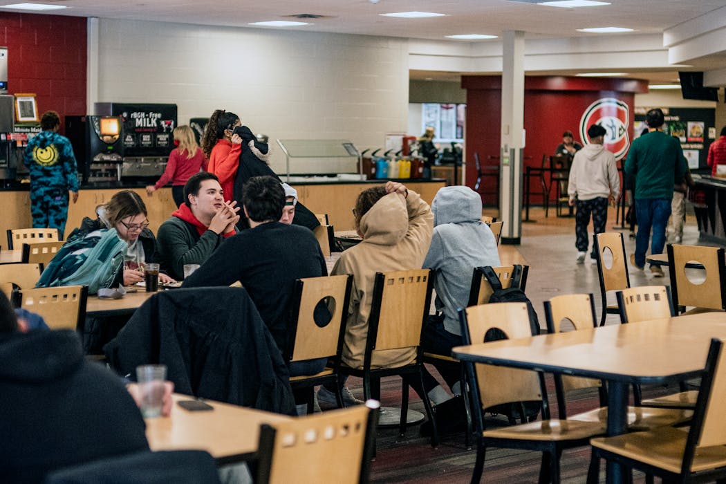 Students ate lunch in a cafeteria at St. Cloud State. School leaders say increasing retention and recruiting nontraditional students will be critical.