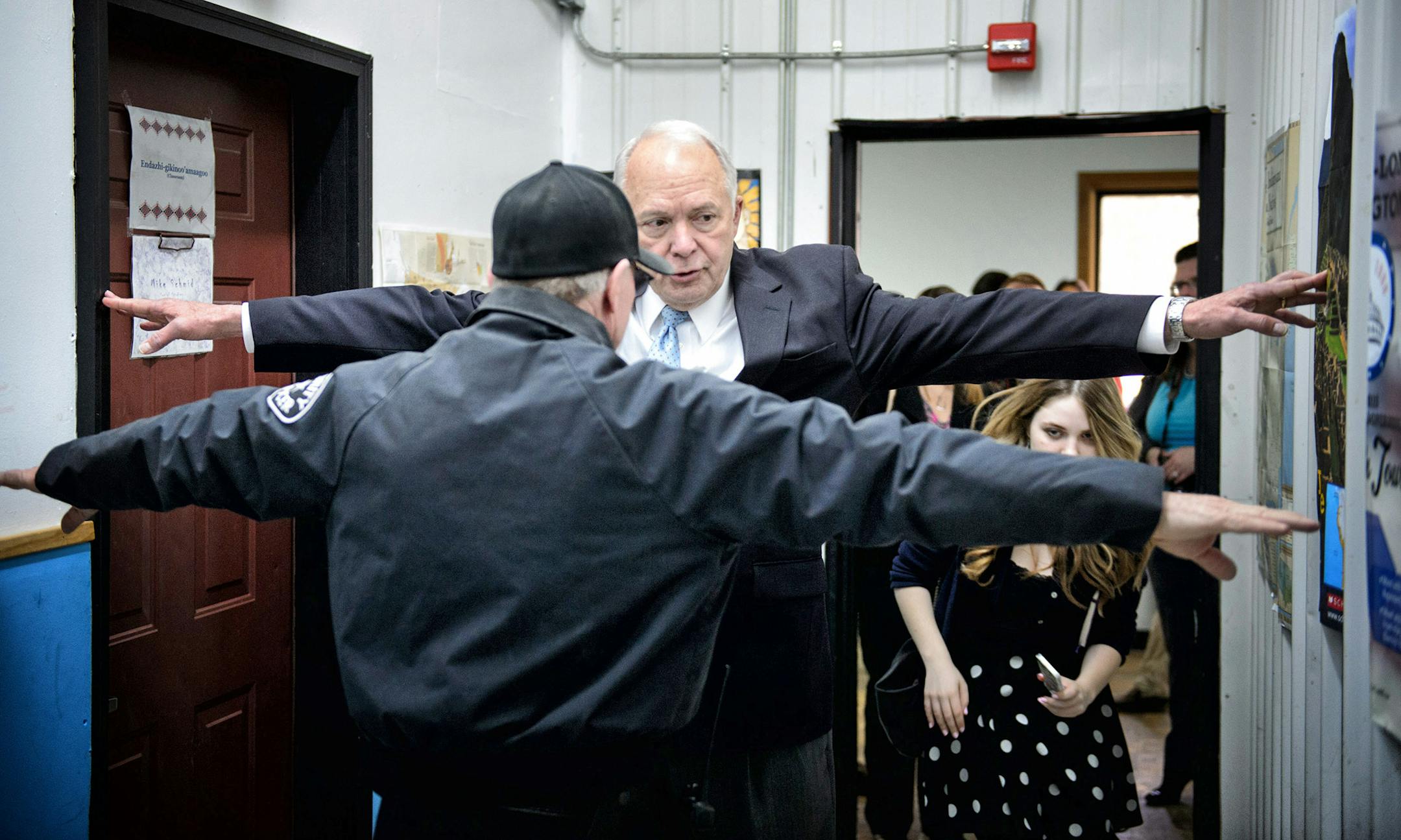School safety and security officer John Parameter showed Rep John Kline how narrow the makeshift hallways are in a building that was once used for a vocational auto body shop and never intended to be used as classroom space. The building has a leaky roof, poor insulation and an overburdened electrical system.