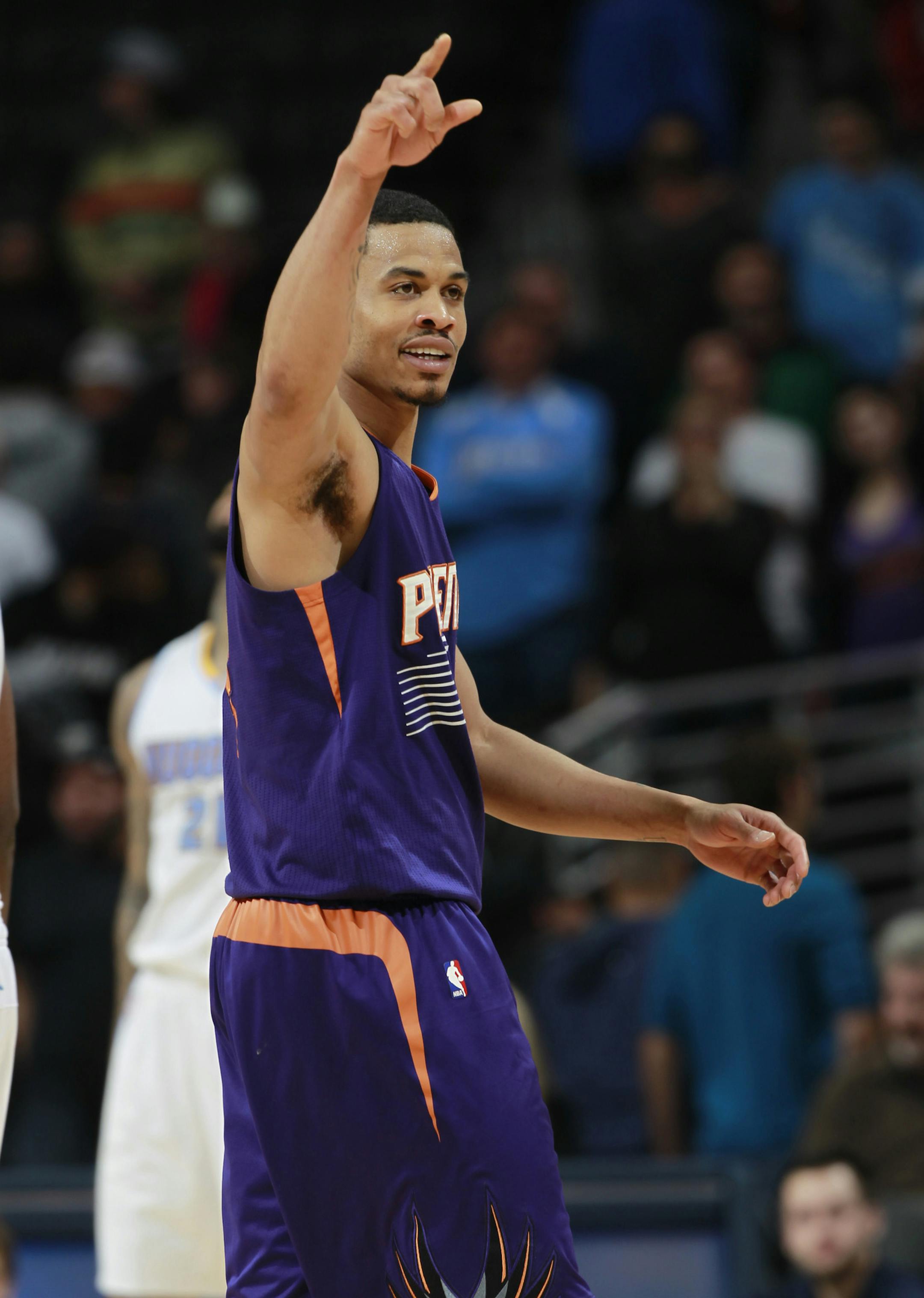 Phoenix Suns guard Gerald Green gestures to bench in final seconds of the overtime period of the Suns' 112-107 overtime victory over the Denver Nuggets in an NBA basketball game in Denver on Tuesday, Feb. 18, 2014. (AP Photo/David Zalubowski) ORG XMIT: MIN2014022818155059