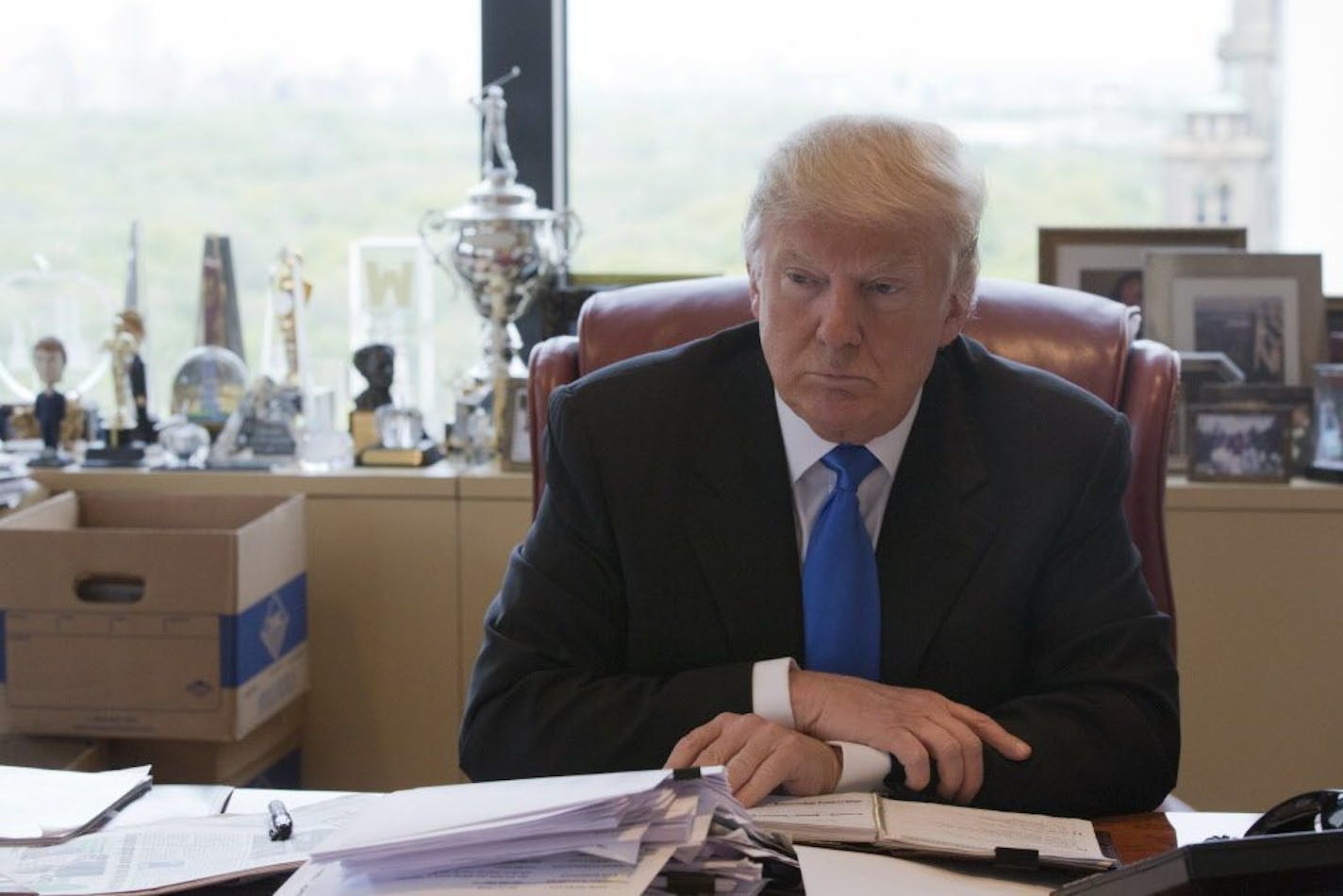 Republican presidential candidate Donald Trump is photographed during an interview with The Associated Press in his office at Trump Tower in New York, Tuesday, May 10, 2016.