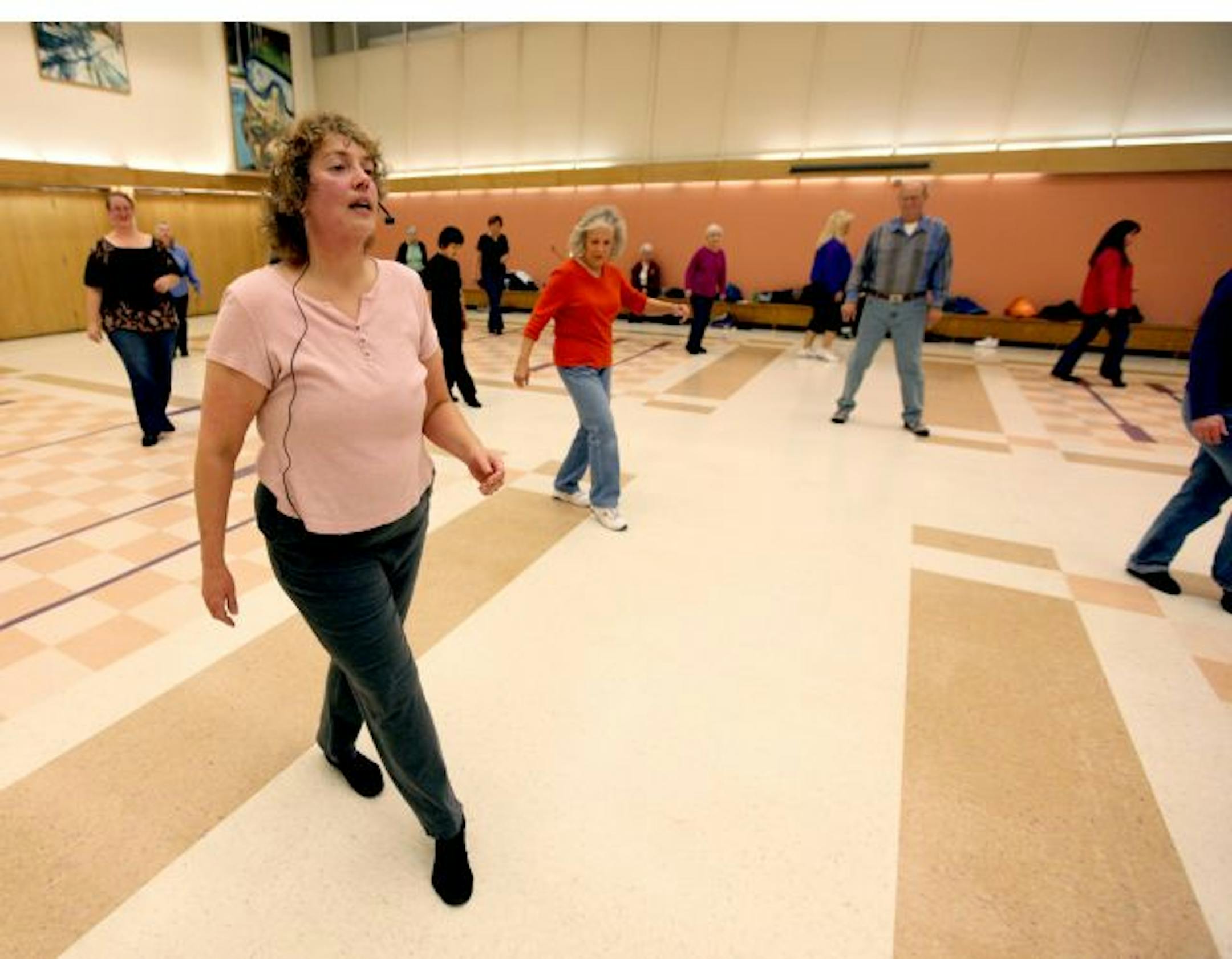 Dance your way to fitness... with line dancing (like community dancing) class where folks learn the moves at the Fairview Community Center. Instructor Jodi Wittman leads her class.