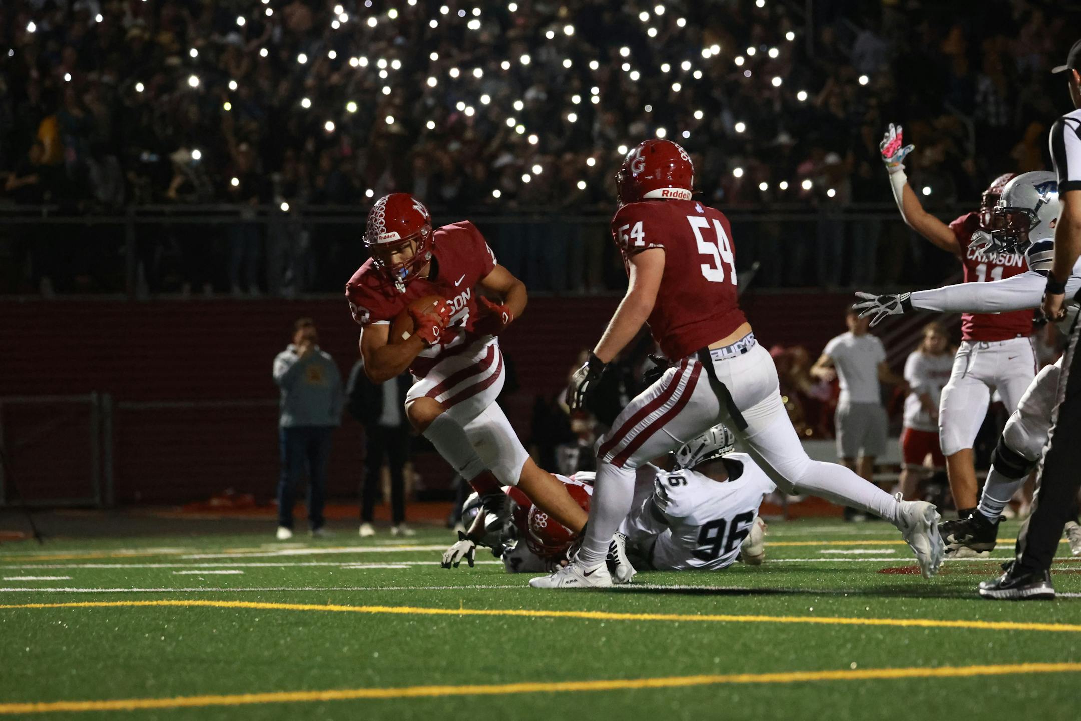 Maple Grove's Jordan Olagbaju (23) scores one of his three touchdowns helping the Crimson to a 43-14 win at Maple Grove Senior High. Photo by Cheryl A. Myers, SportsEngine