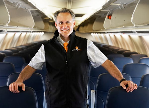 Image of Sun Country CEO Jude Bricker on a Sun Country plane.