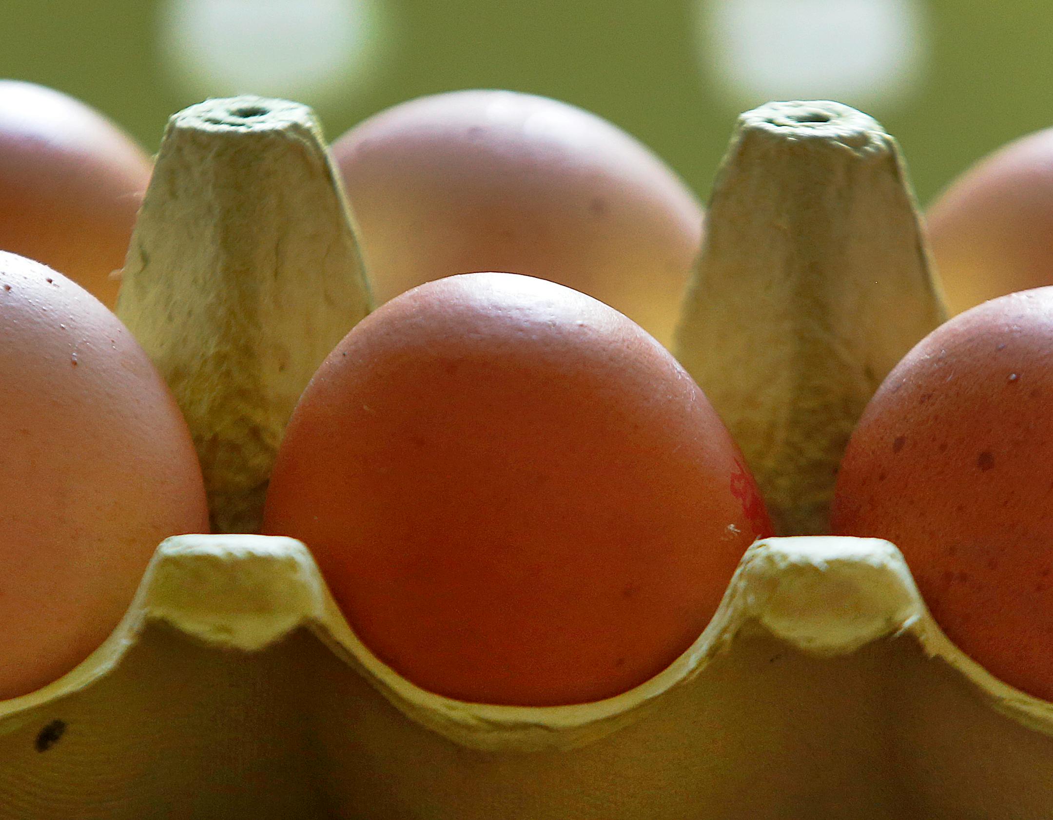 A close up photo of eggs in an egg carton
