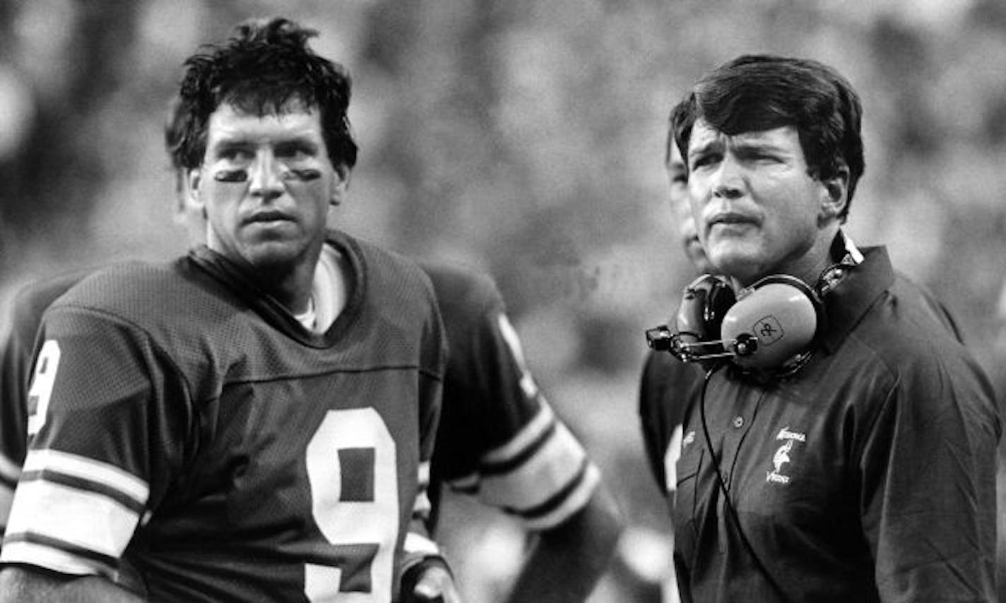 Minnesota Vikings head coach Les Steckel and quarterback Tommy Kramer survey the damage from the sidelines as they watch the San Diego Chargers ruin Steckel's coaching debut with a 42-13 rout in Minneapolis, Sept. 3, 1984.