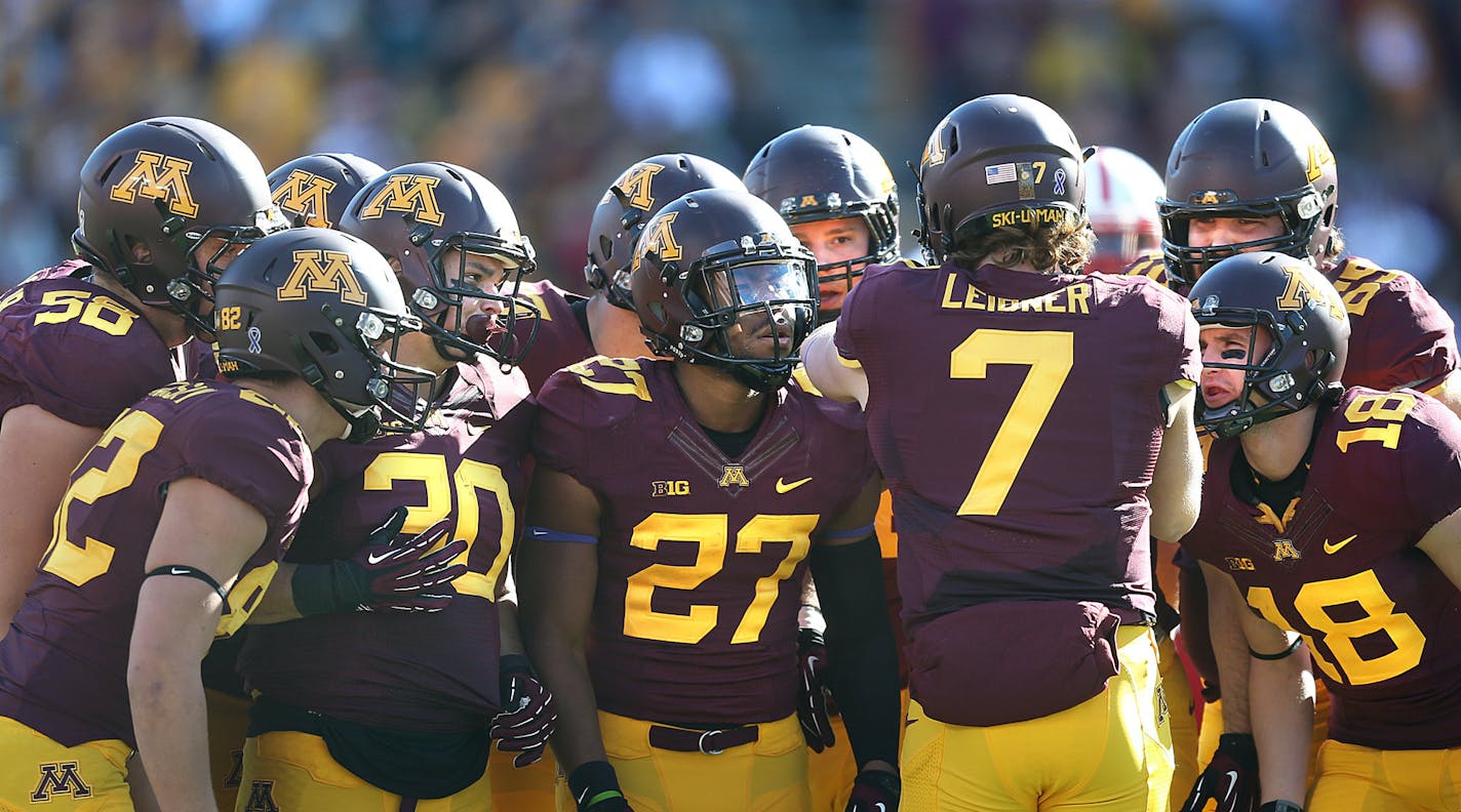 Quarterback Mitch Leidner calls a play in the huddle last season vs. Nebraska.