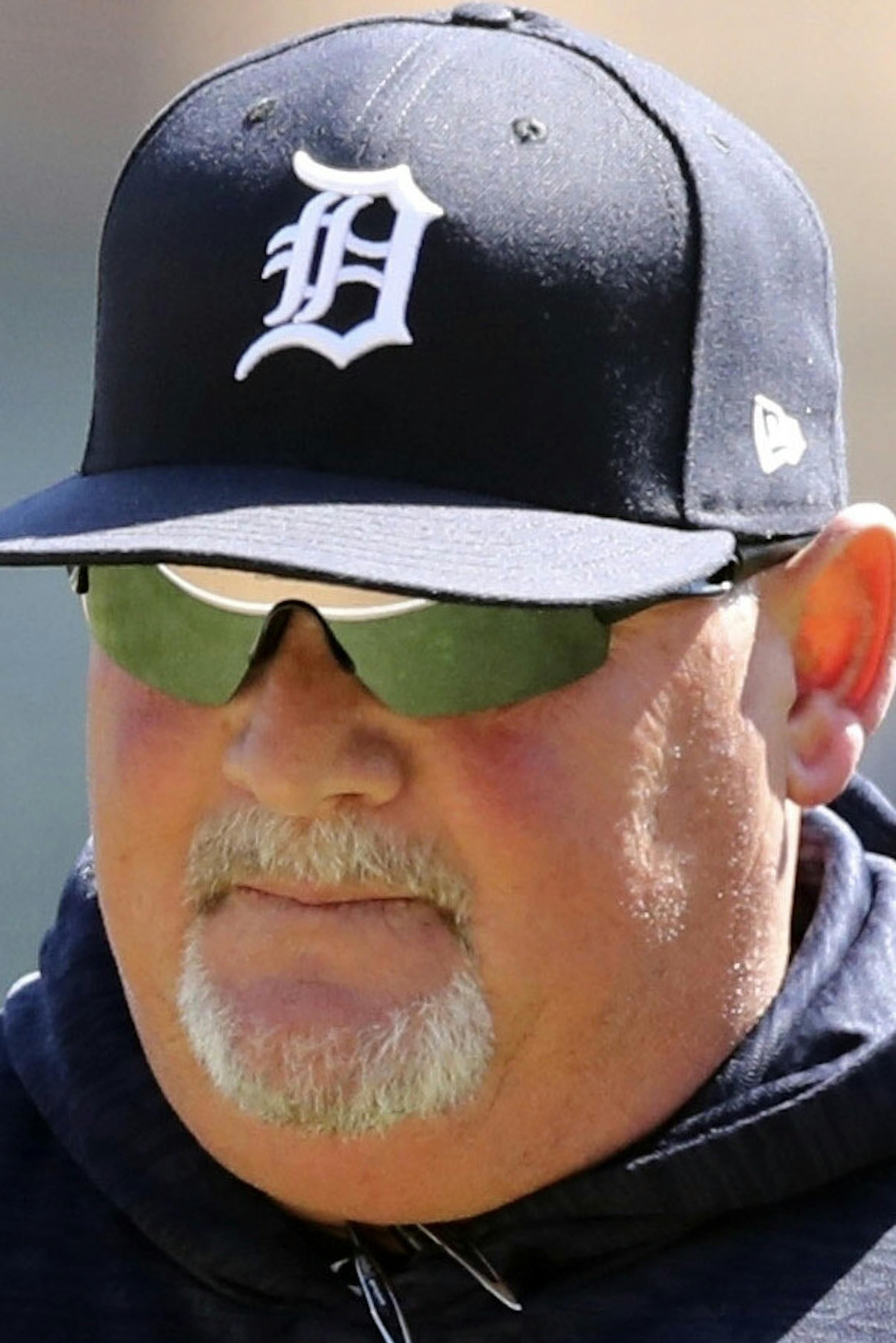 FILE- In an April 20, 2018 file photo Detroit Tigers pitching coach Chris Bosio walks to the dugout during the seventh inning of game one of a baseball doubleheader against the Kansas City Royals in Detroit. The Tigers have fired Bosio saying his contract was terminated for insensitive comments that were in violation of team policy and his contract. The team says it holds employees to the highest standards of personal conduct on and off the field, adding it has zero tolerance for Bosio's behavio