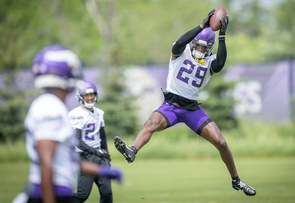 Minnesota Vikings JoeJuan Williams makes a grab during drills on the practice field at the TCO Performance Center in Eagan, Minn., on Tuesday, May 30,