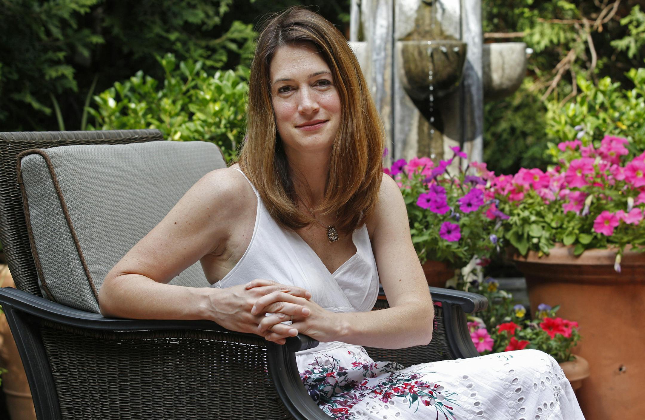 FILE - This June 19, 2012 photo shows Gillian Fllynn, author of "Gone Girl" in Chicago. The million-selling author has agreed to write two more books for Random House Inc. The publisher announced Thursday, Nov. 15, that she will write a novel and a young adult novel. The books currently are untitled and publication dates have not been set. "Gone Girl" has been among the top sellers of 2012, with sales approaching 2 million copies. Flynn's previous works include "Sharp Objects" and "Dark Places."